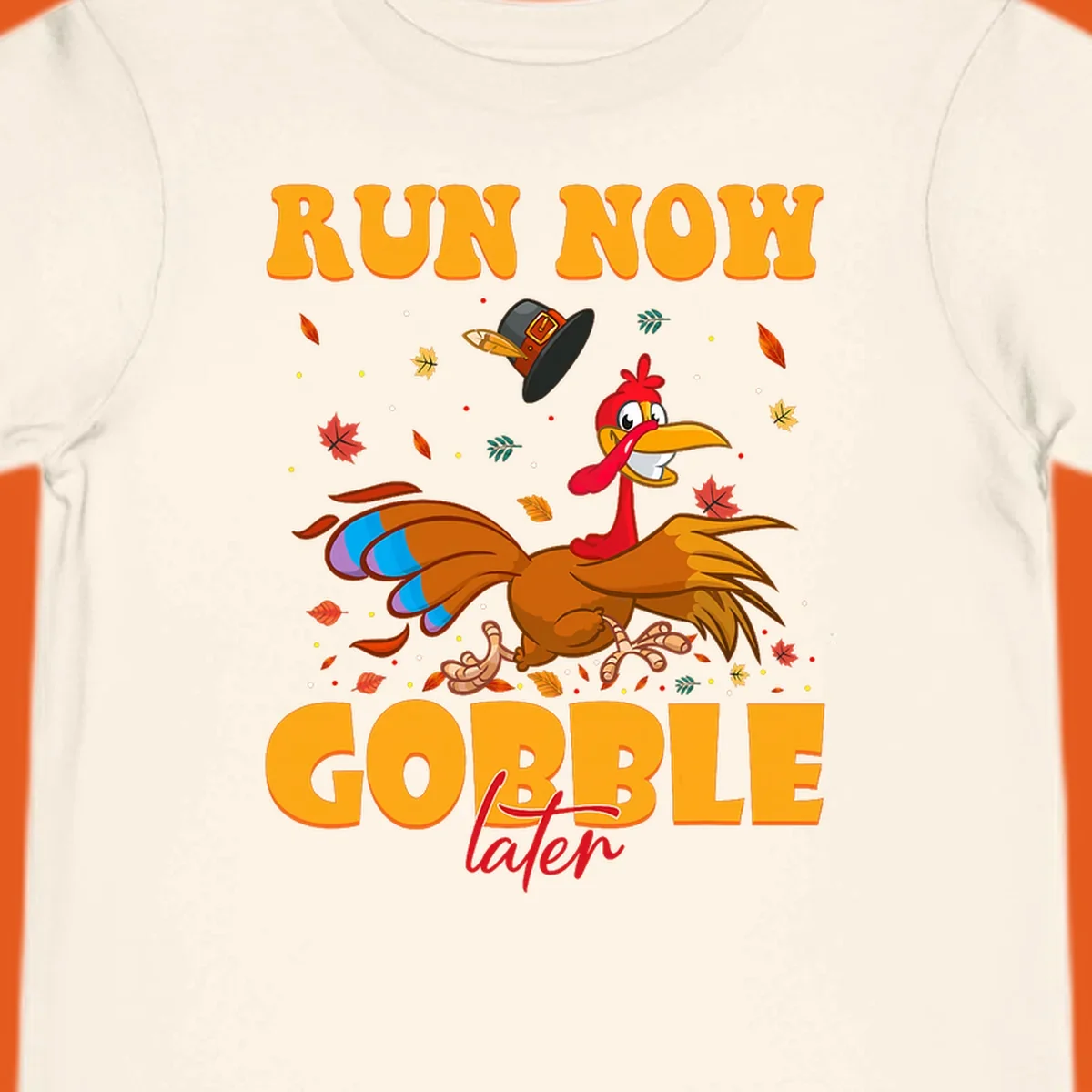 Cartoon turkey running with pilgrim hat, text "RUN NOW GOBBLE later" for Turkey Trot shirt.