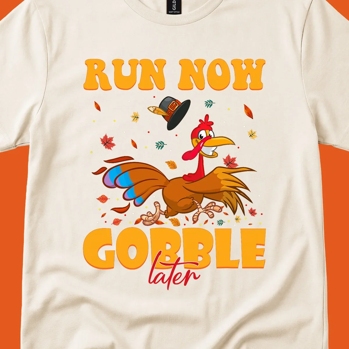 Cartoon turkey running with pilgrim hat, text "RUN NOW GOBBLE later" for Turkey Trot shirt.