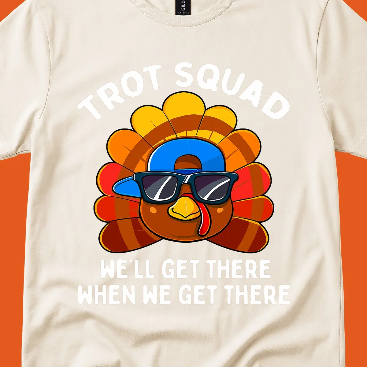 Turkey Trot Squad cool turkey with sunglasses and cap, text 'WE'LL GET THERE WHEN WE GET THERE' shirt