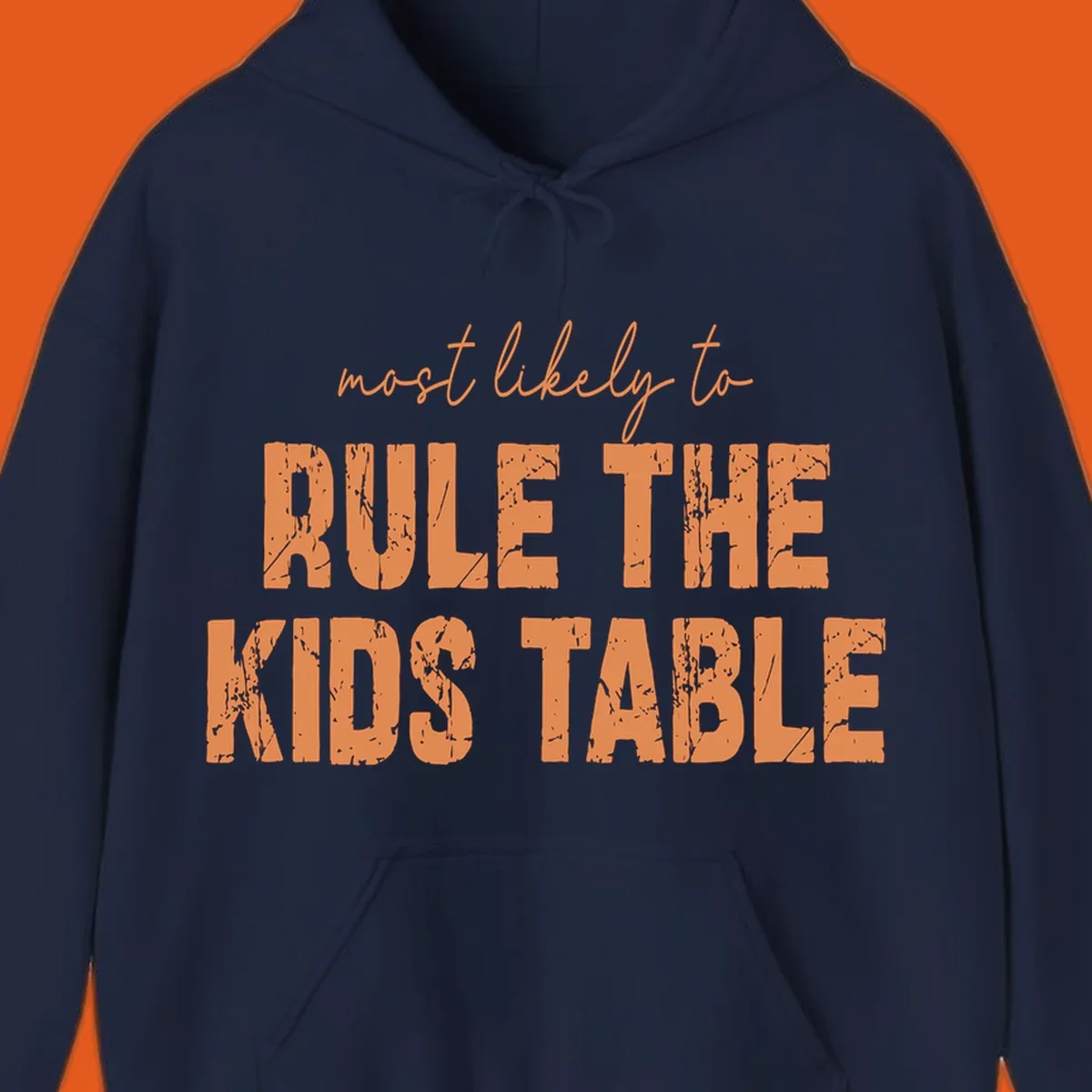 Text design 'most likely to rule the kids table' in distressed orange font.