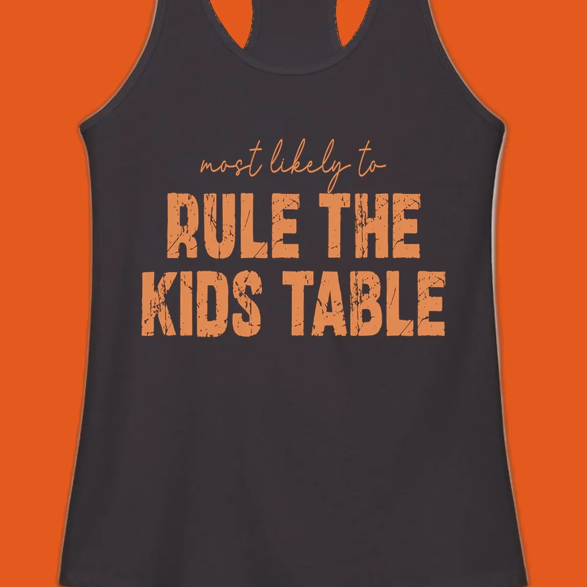 Text design 'most likely to rule the kids table' in distressed orange font.