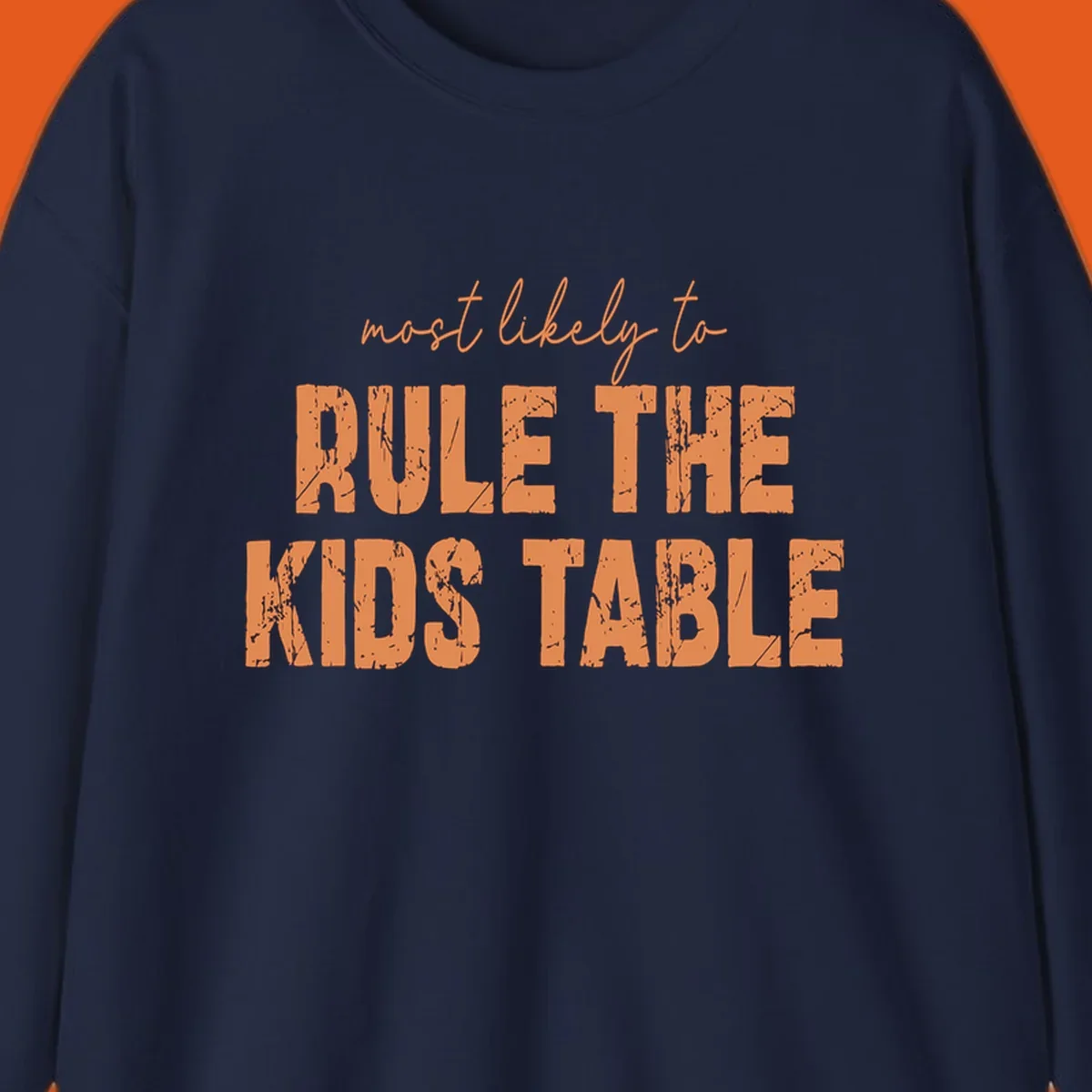 Text design 'most likely to rule the kids table' in distressed orange font.