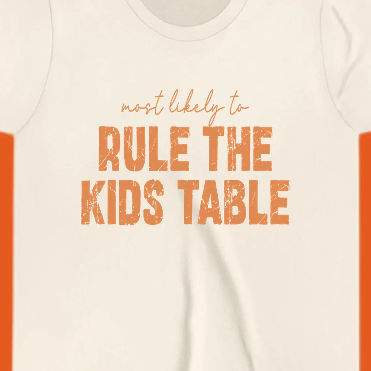 Text design 'most likely to rule the kids table' in distressed orange font.
