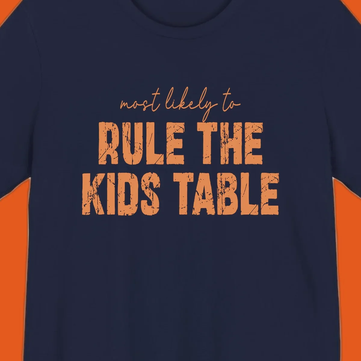Text design 'Most Likely to Rule the Kids Table' in distressed orange font.
