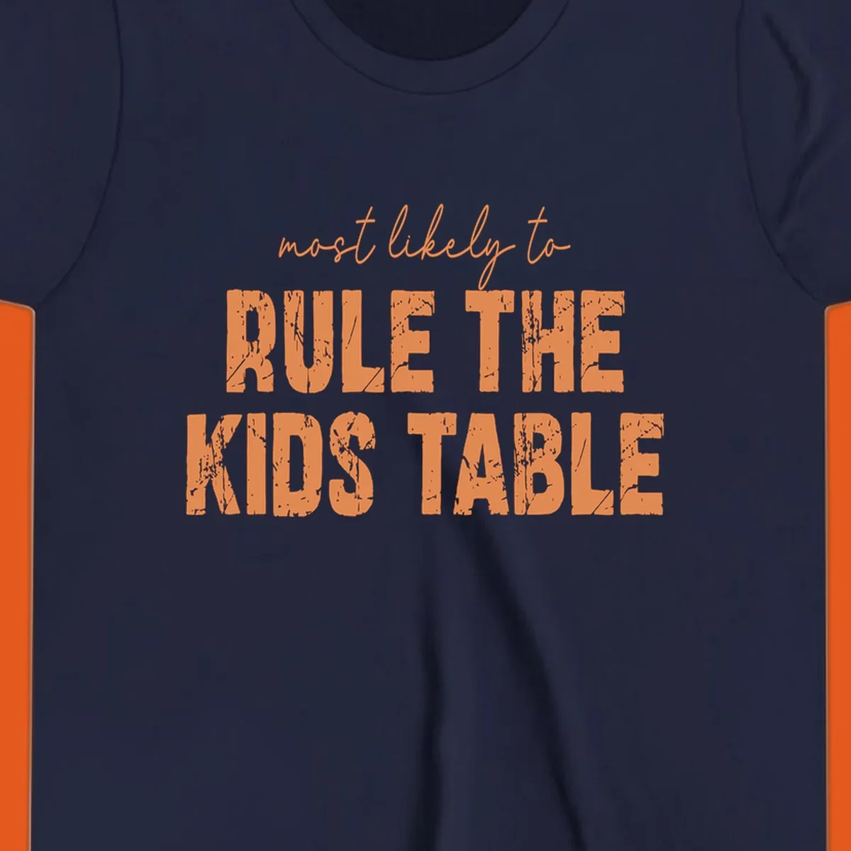 Text design 'Most Likely to Rule the Kids Table' in distressed orange font.