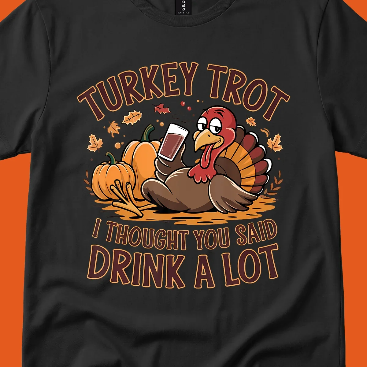 Cartoon turkey with pumpkins and text 'Turkey Trot I Thought You Said Drink A Lot' for Thanksgiving race.
