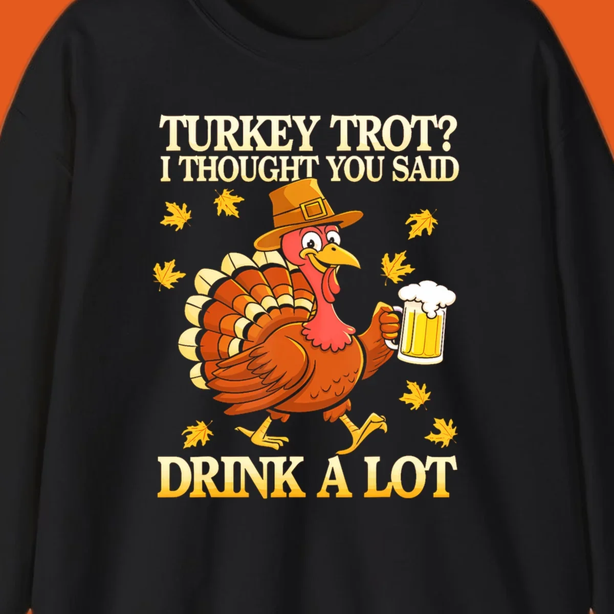 Funny turkey trot drinking pun design with a turkey holding a beer and text 'Turkey Trot? I thought you said Drink a Lot'.