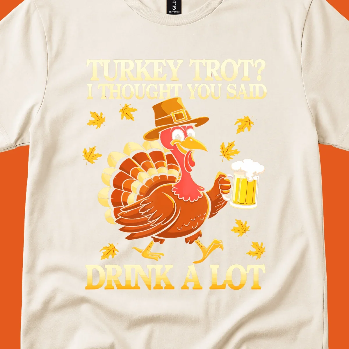 Funny turkey trot drinking pun design with a turkey holding a beer and text 'Turkey Trot? I thought you said Drink a Lot'.