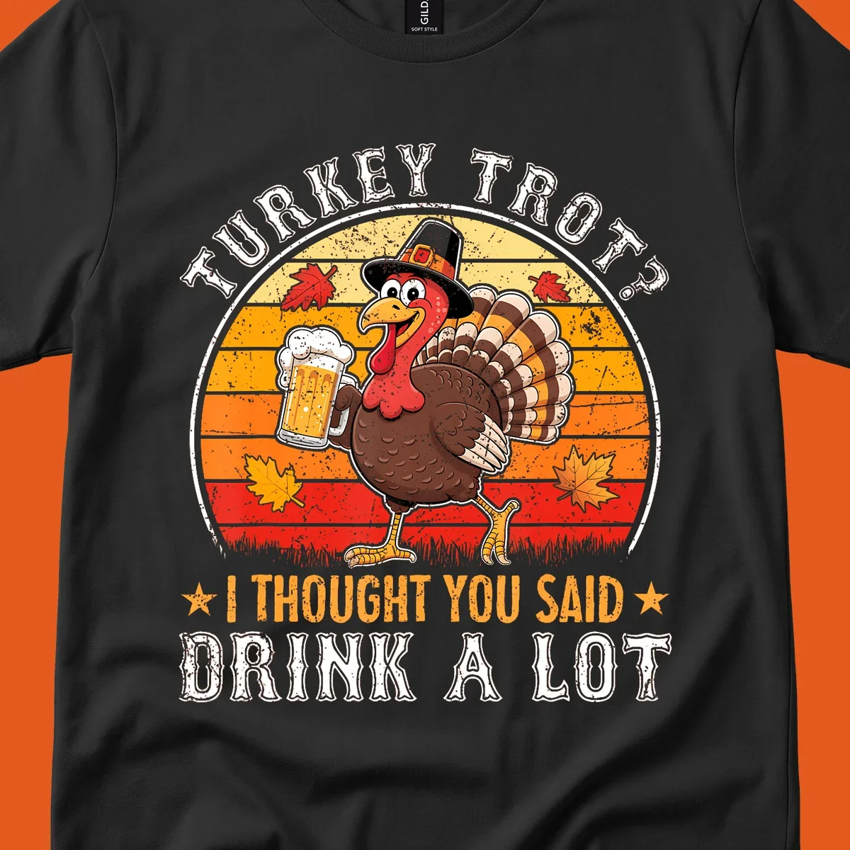 Turkey Trot Drink A Lot Design: Cartoon turkey in pilgrim hat holding beer, with text about drinking.