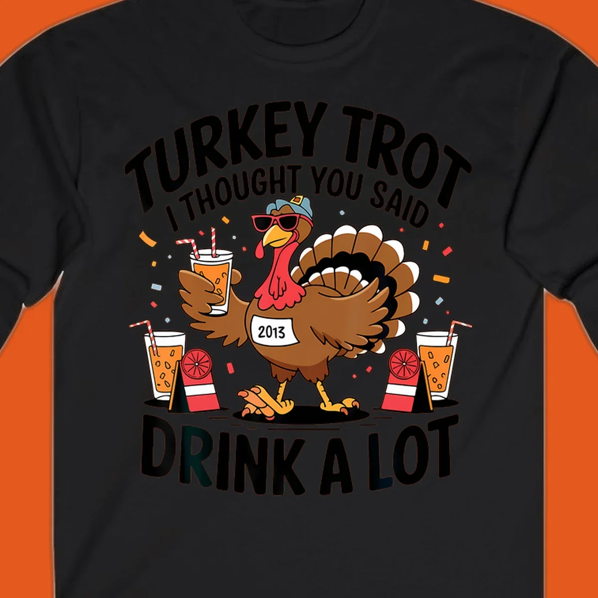 Turkey Trot I Thought You Said Drink A Lot design featuring a cartoon turkey holding a drink.