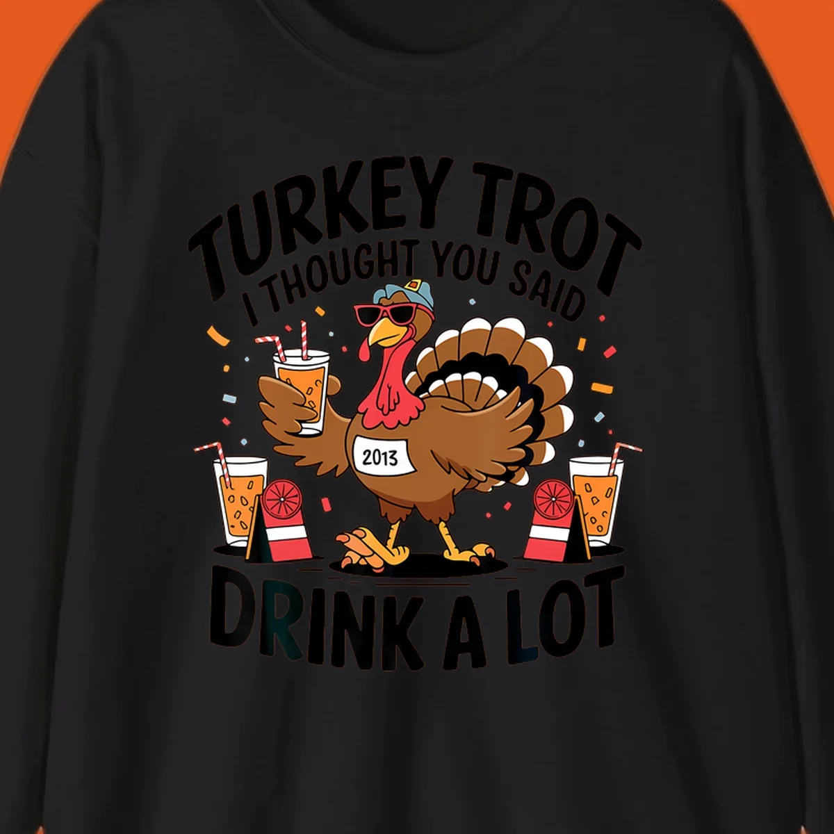 Turkey Trot I Thought You Said Drink A Lot design featuring a cartoon turkey holding a drink.