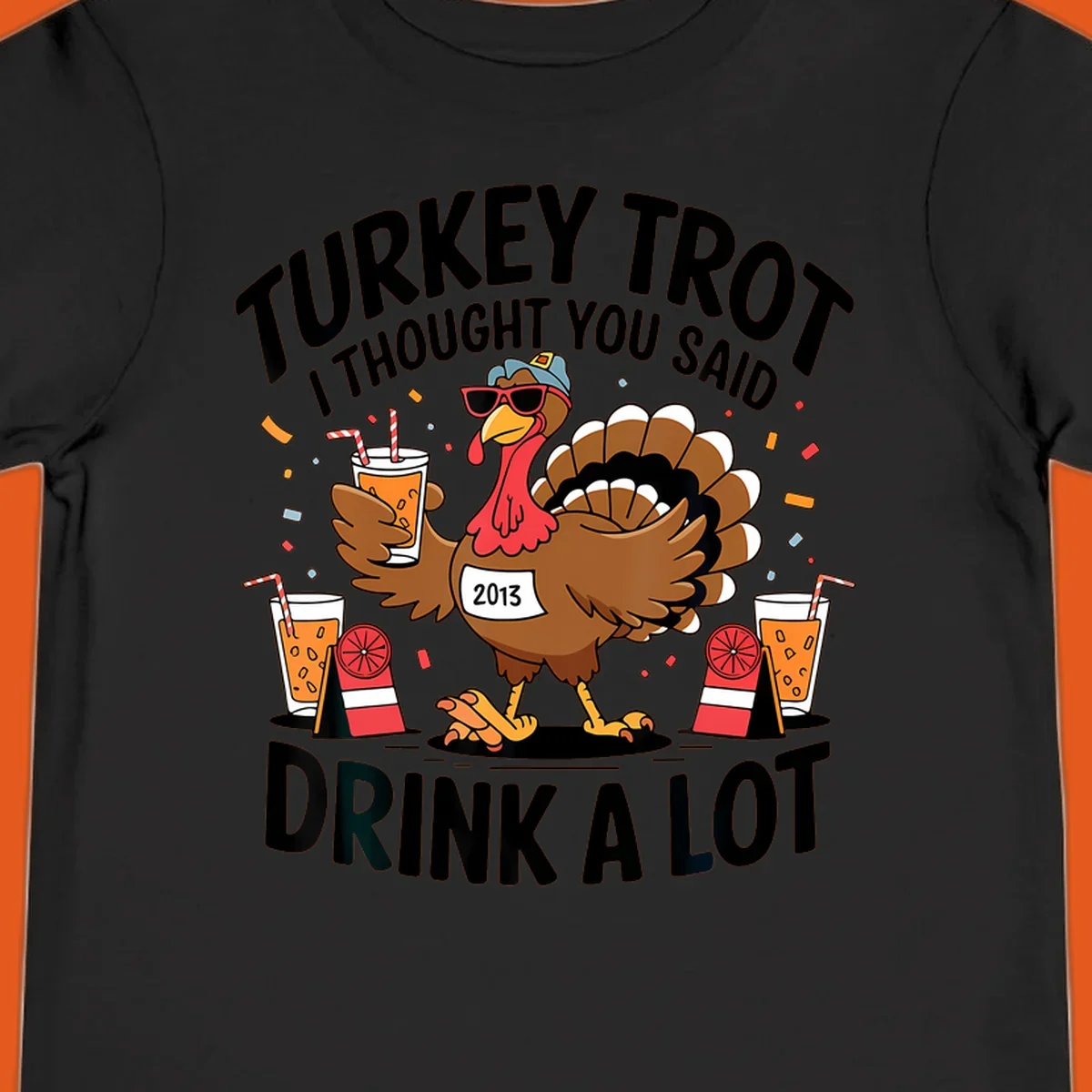 Turkey Trot I Thought You Said Drink A Lot design featuring a cartoon turkey holding a drink.