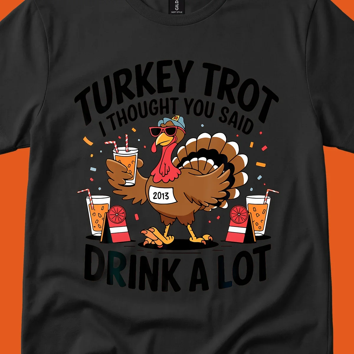 Turkey Trot I Thought You Said Drink A Lot design featuring a cartoon turkey holding a drink.