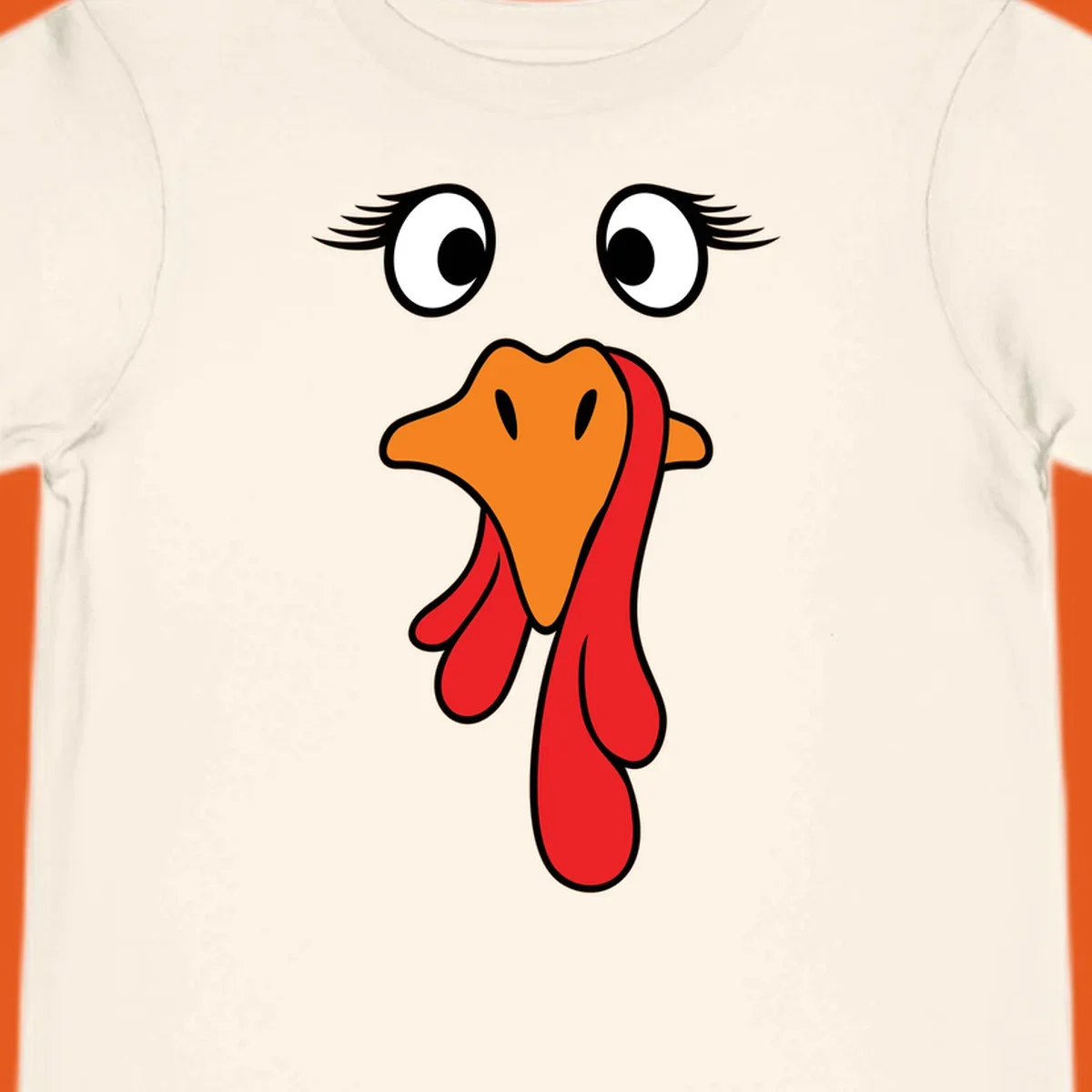 Funny turkey face graphic with googly eyes and wattle, perfect for Thanksgiving Trot runners.