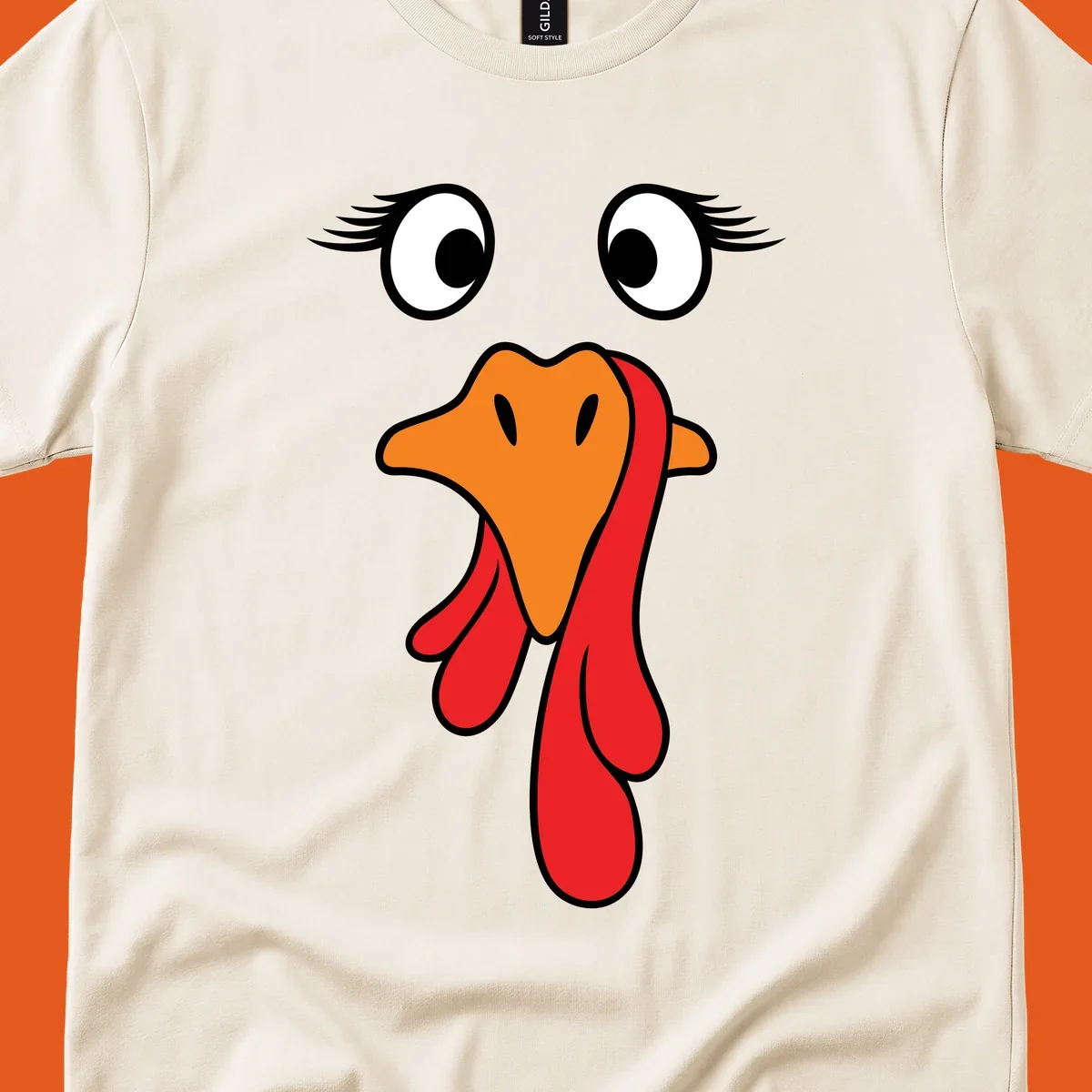 Funny turkey face graphic with googly eyes and wattle, perfect for Thanksgiving Trot runners.