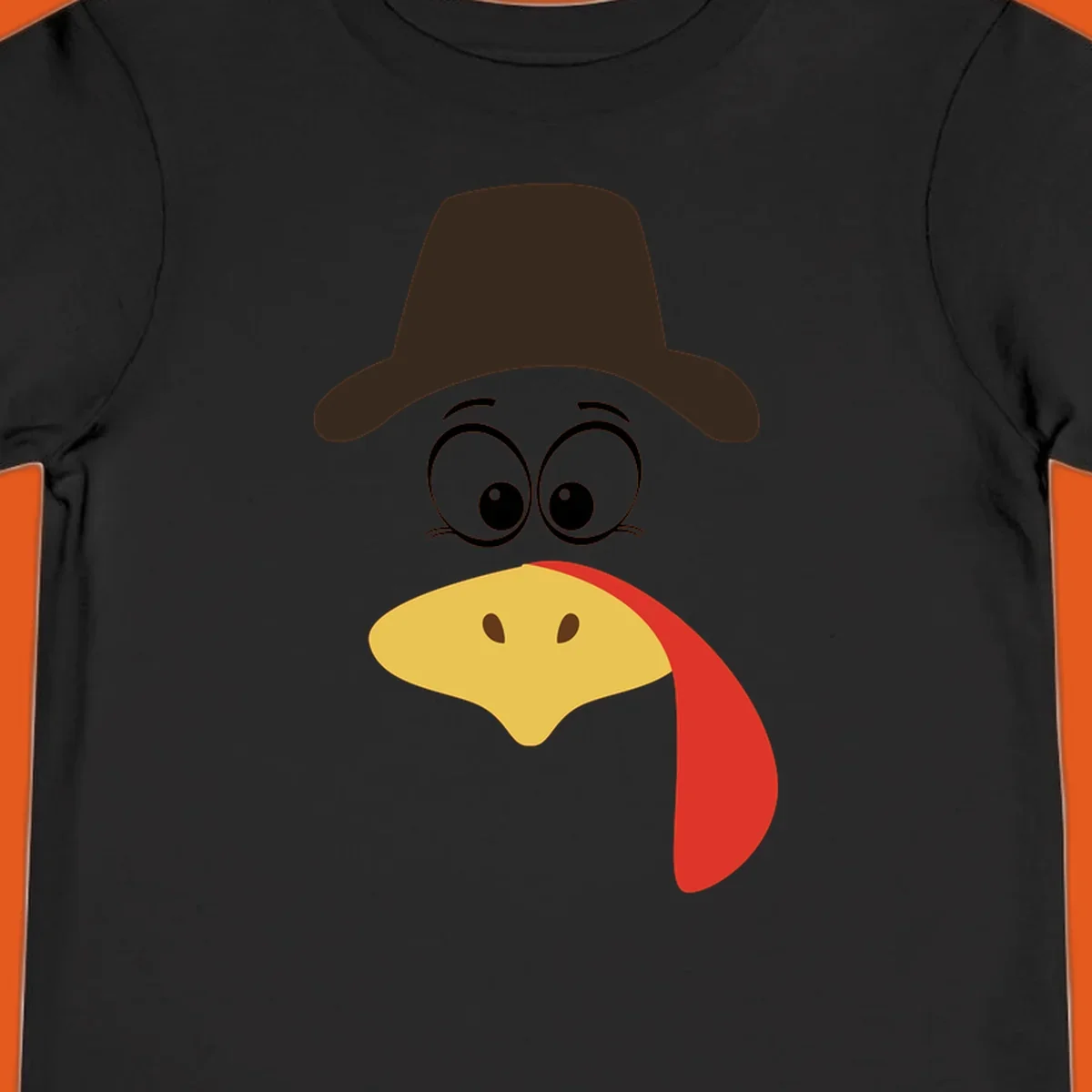 Cartoon turkey face wearing a cowboy hat, graphic for Turkey Trot runs.