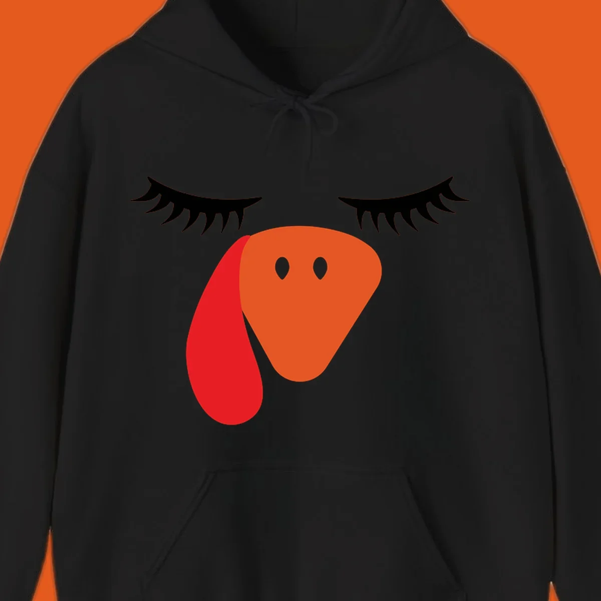 Funny turkey face graphic with closed eyes and eyelashes, perfect for Turkey Trot shirts.