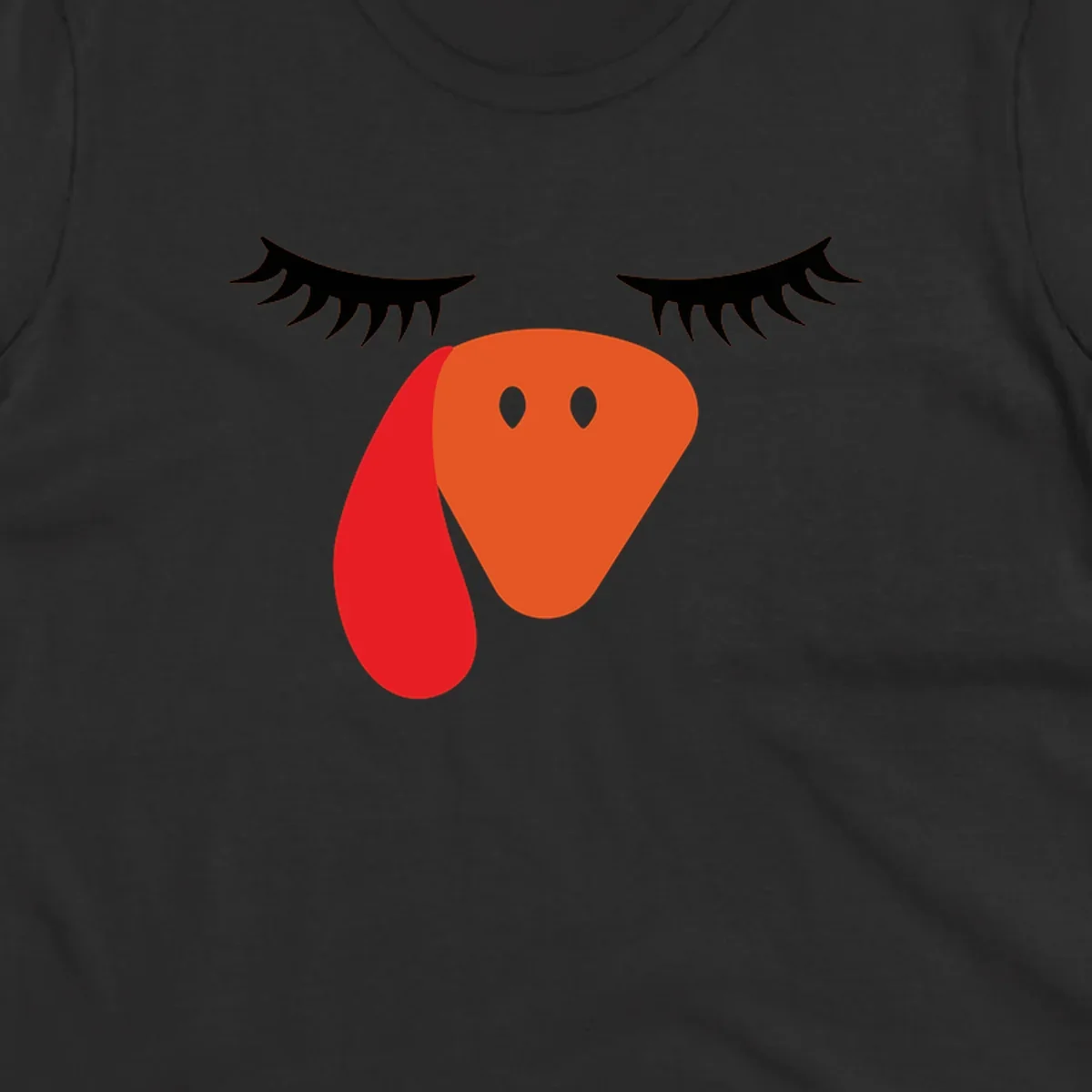 Funny turkey face graphic with closed eyes and eyelashes, perfect for Turkey Trot shirts.