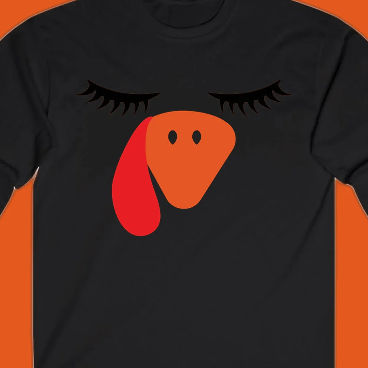 Funny turkey face graphic with closed eyes and eyelashes, perfect for Turkey Trot shirts.
