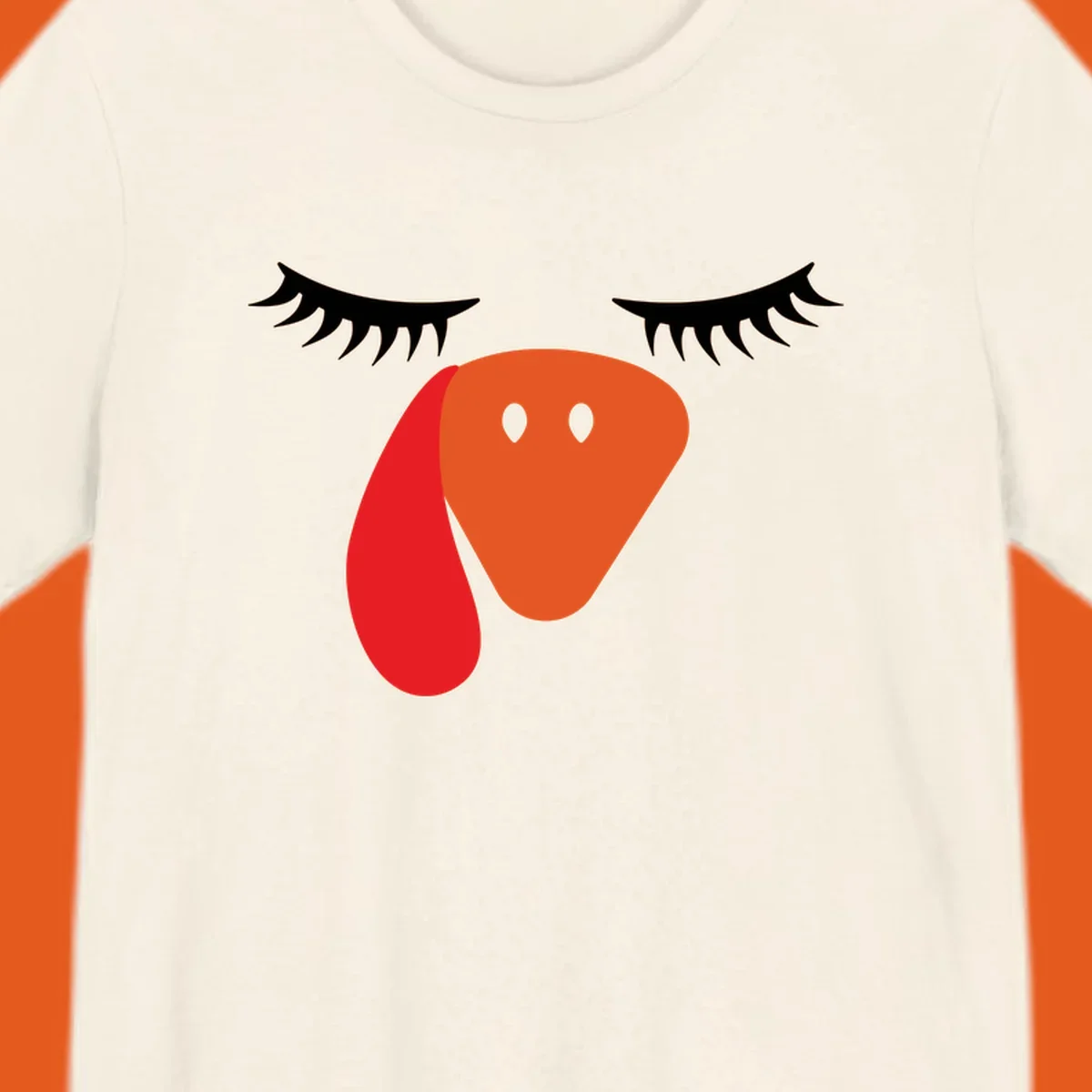 Funny turkey face graphic with closed eyes and eyelashes, perfect for Turkey Trot shirts.