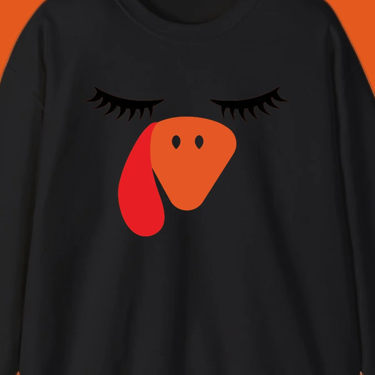 Funny turkey face graphic with closed eyes and eyelashes, perfect for Turkey Trot shirts.