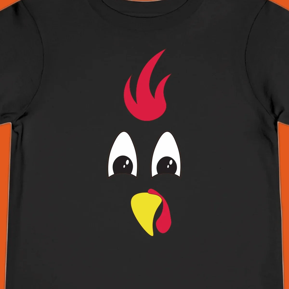 Rooster face graphic for Turkey Trot runners, featuring a red comb and yellow beak.
