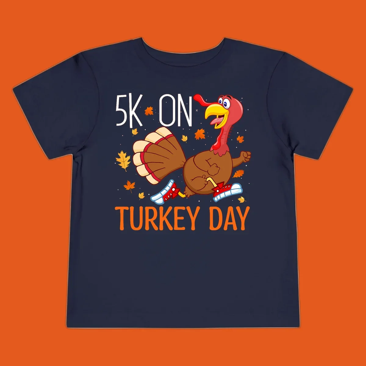 Running turkey illustration with "5K ON TURKEY DAY" text for Turkey Trot shirts.