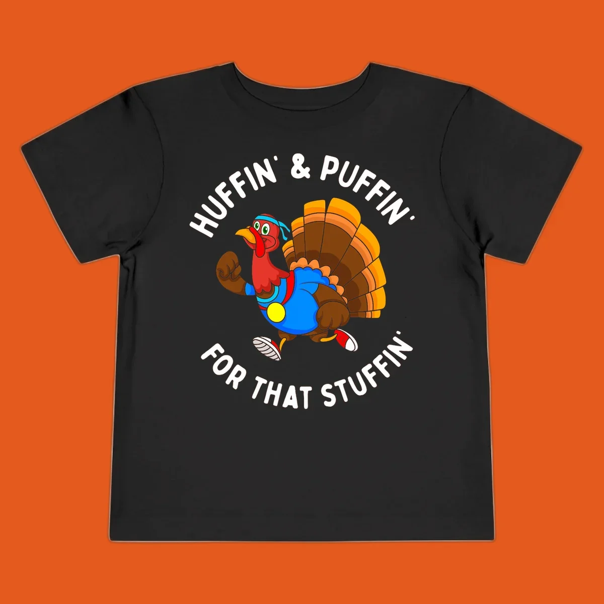 Running turkey cartoon with text 'Huffin' & Puffin' For That Stuffin'' for Turkey Trot runner.