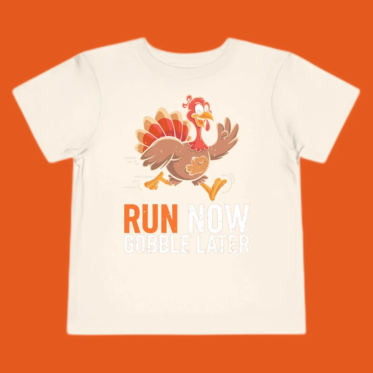 Illustration of a running turkey with the text 'Run Now Gobble Later', representing the turkey trot runner concept.