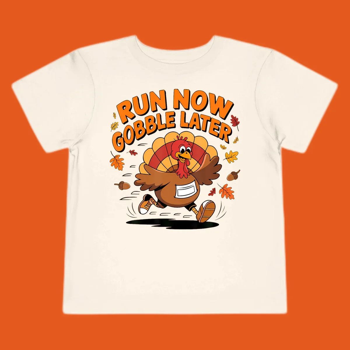 Cartoon turkey running with text "RUN NOW GOBBLE LATER" for Thanksgiving Turkey Trot shirt.