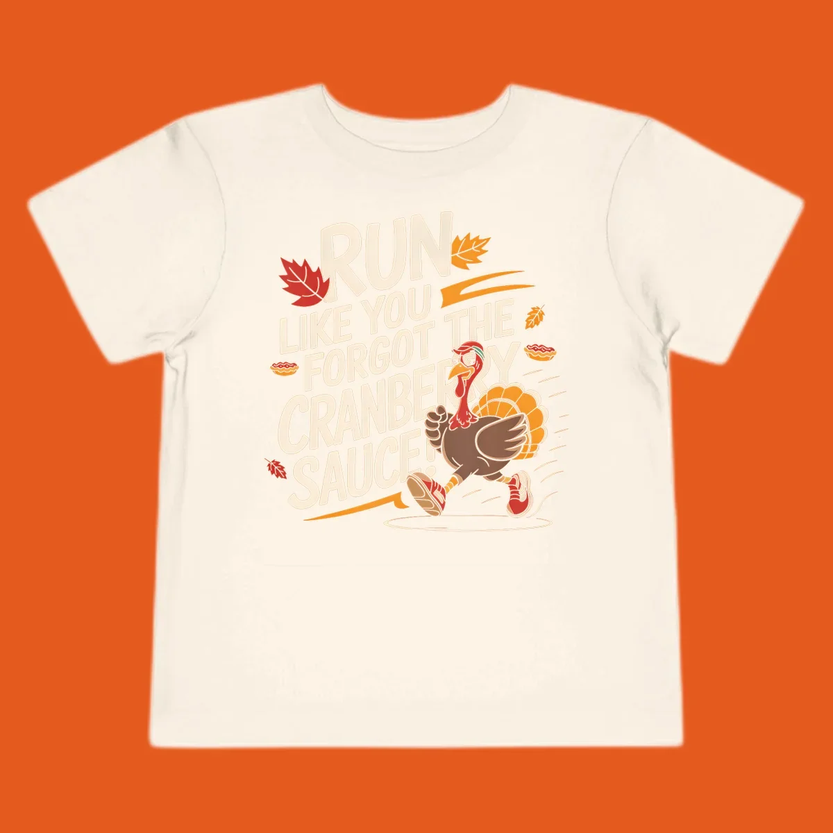 Running turkey illustration with text 'Run Like You Forgot The Cranberry Sauce' for Turkey Trot shirts.