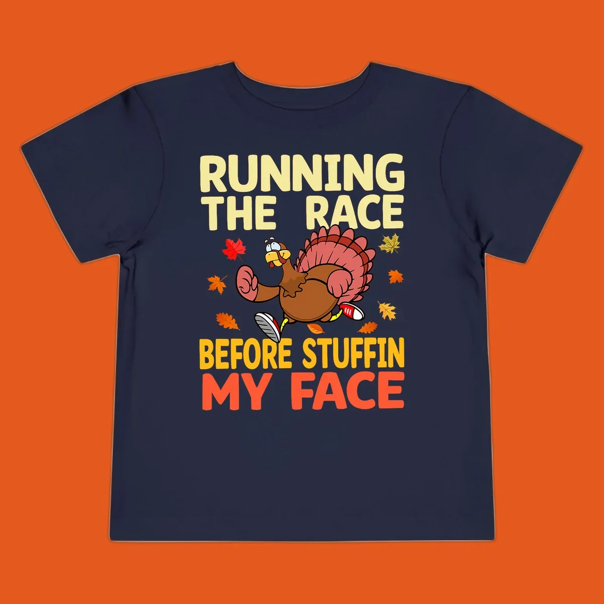 Running turkey with text "RUNNING THE RACE BEFORE STUFFIN MY FACE", a Thanksgiving run concept.