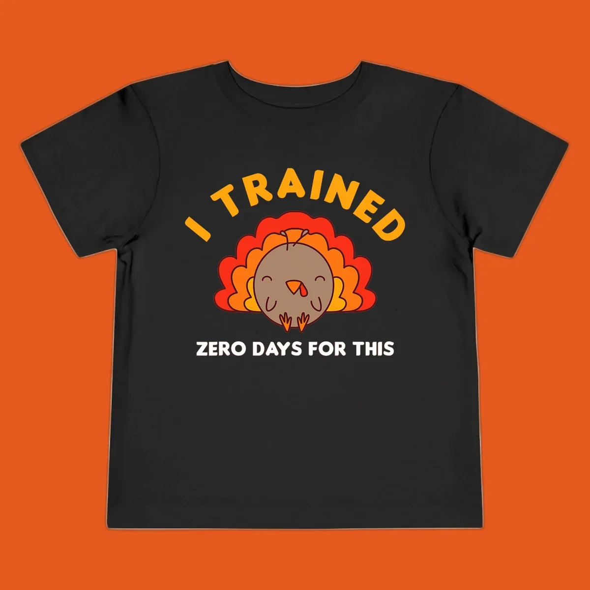Cartoon turkey with text 'I TRAINED ZERO DAYS FOR THIS', concept for Turkey Trot running shirt.