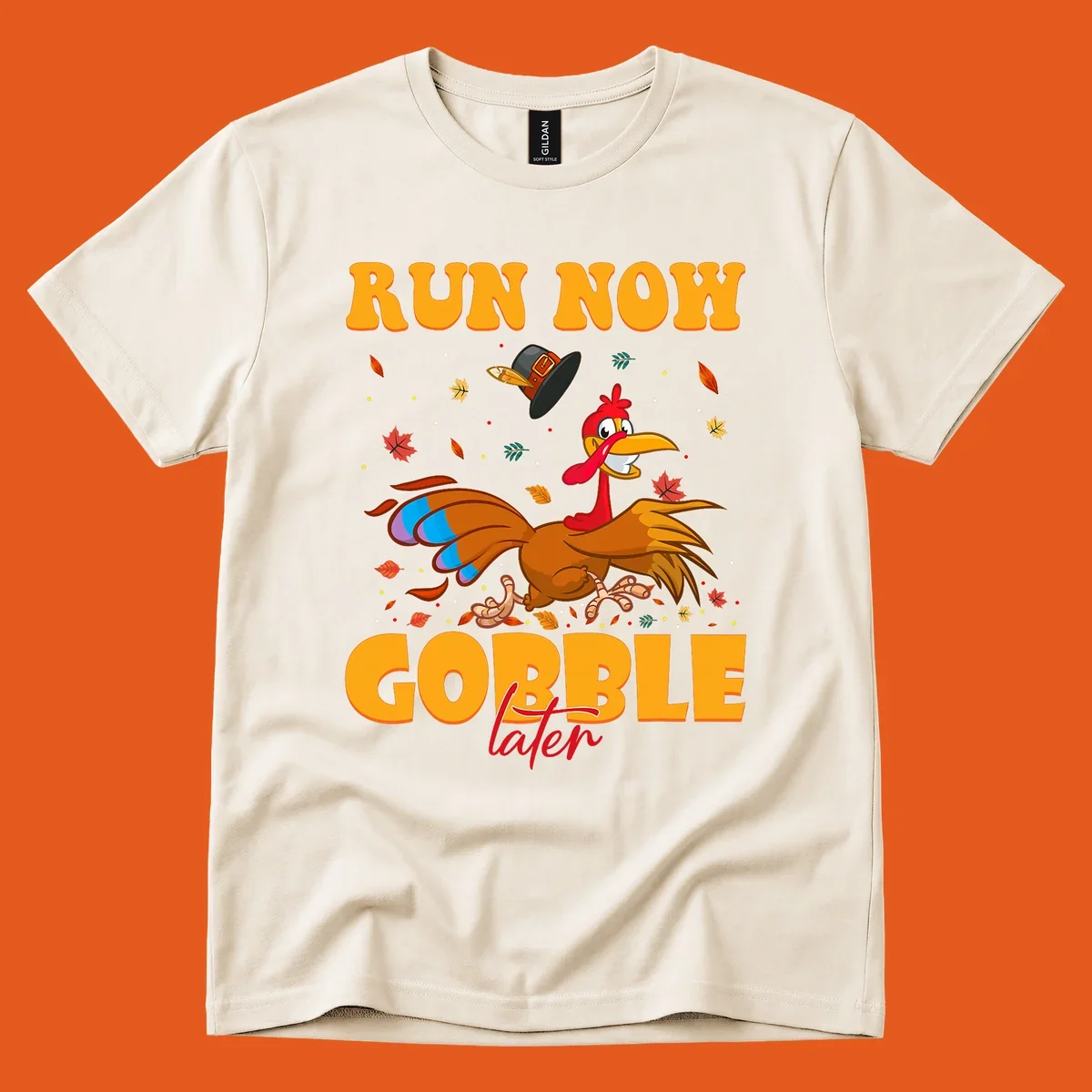 Cartoon turkey running with pilgrim hat, text "RUN NOW GOBBLE later" for Turkey Trot shirt.