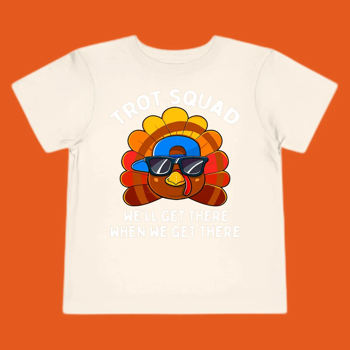 Turkey Trot Squad cool turkey with sunglasses and cap, text 'WE'LL GET THERE WHEN WE GET THERE' shirt
