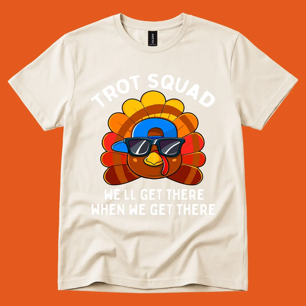 Turkey Trot Squad cool turkey with sunglasses and cap, text 'WE'LL GET THERE WHEN WE GET THERE' shirt