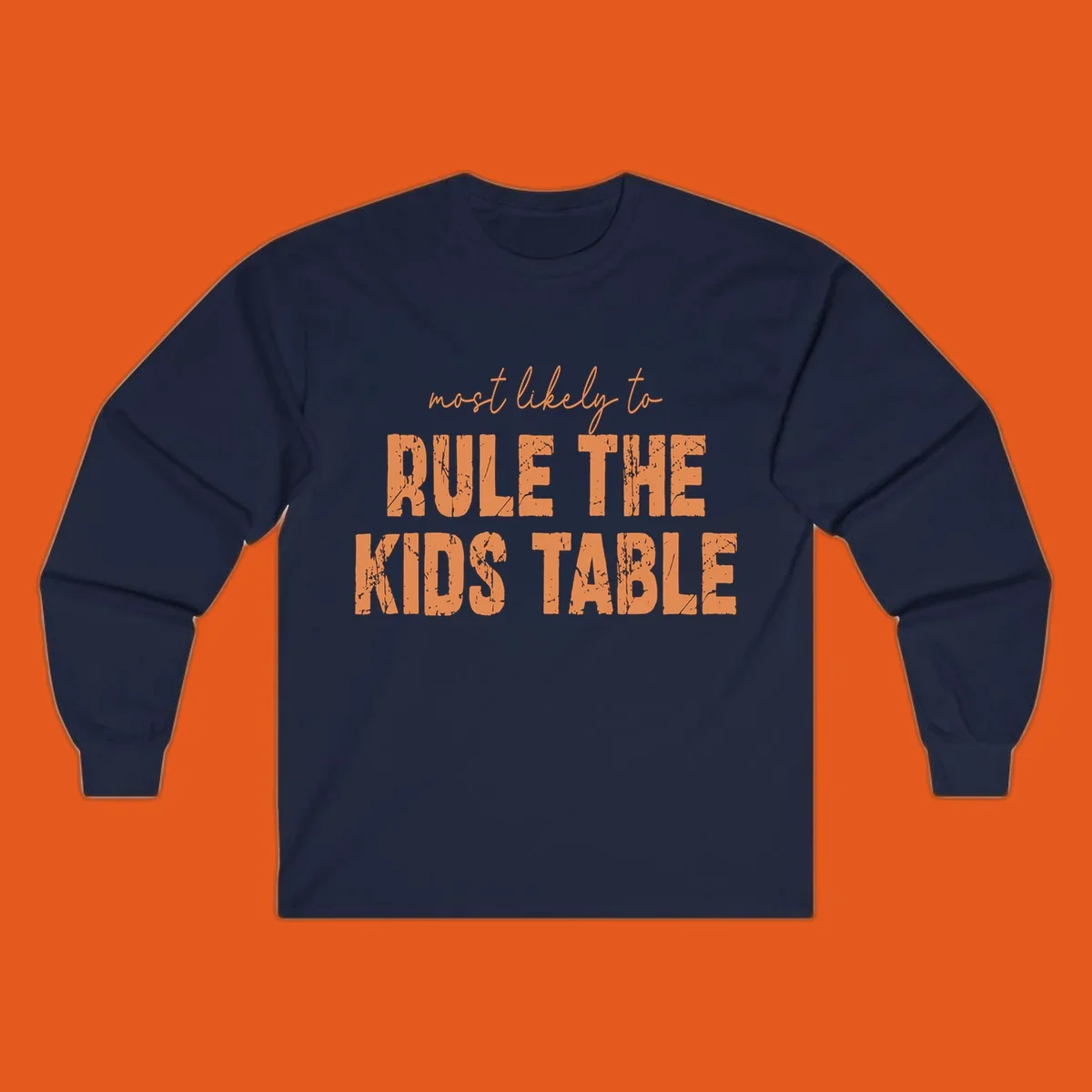Text design 'most likely to rule the kids table' in distressed orange font.