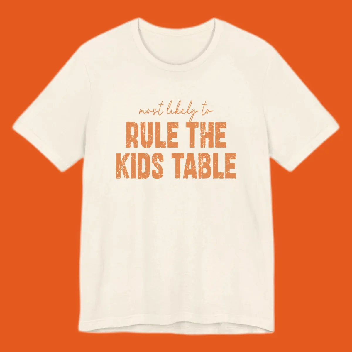 Text design 'most likely to rule the kids table' in distressed orange font.