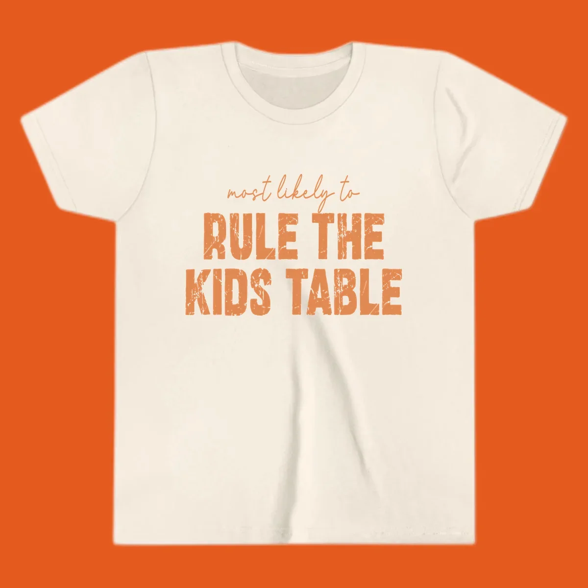 Text design 'most likely to rule the kids table' in distressed orange font.