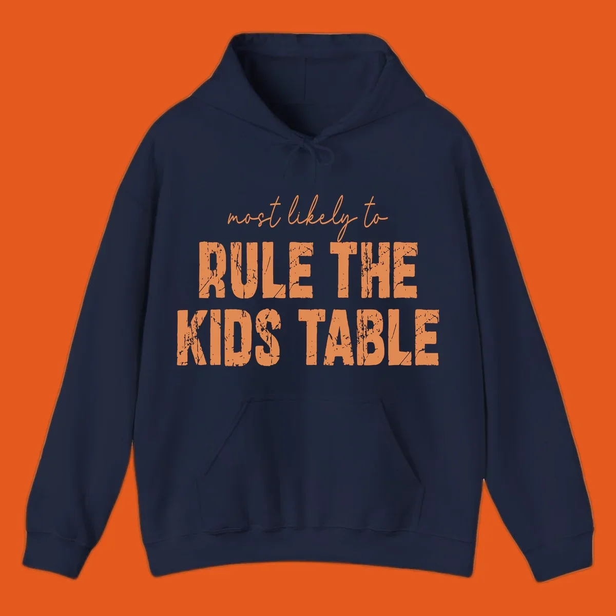 Text design 'Most Likely to Rule the Kids Table' in distressed orange font.