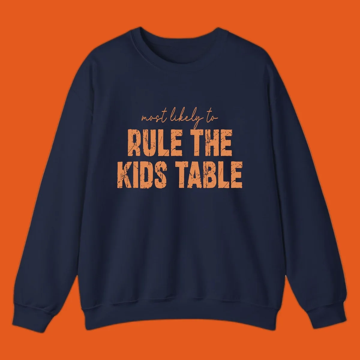 Text design 'Most Likely to Rule the Kids Table' in distressed orange font.