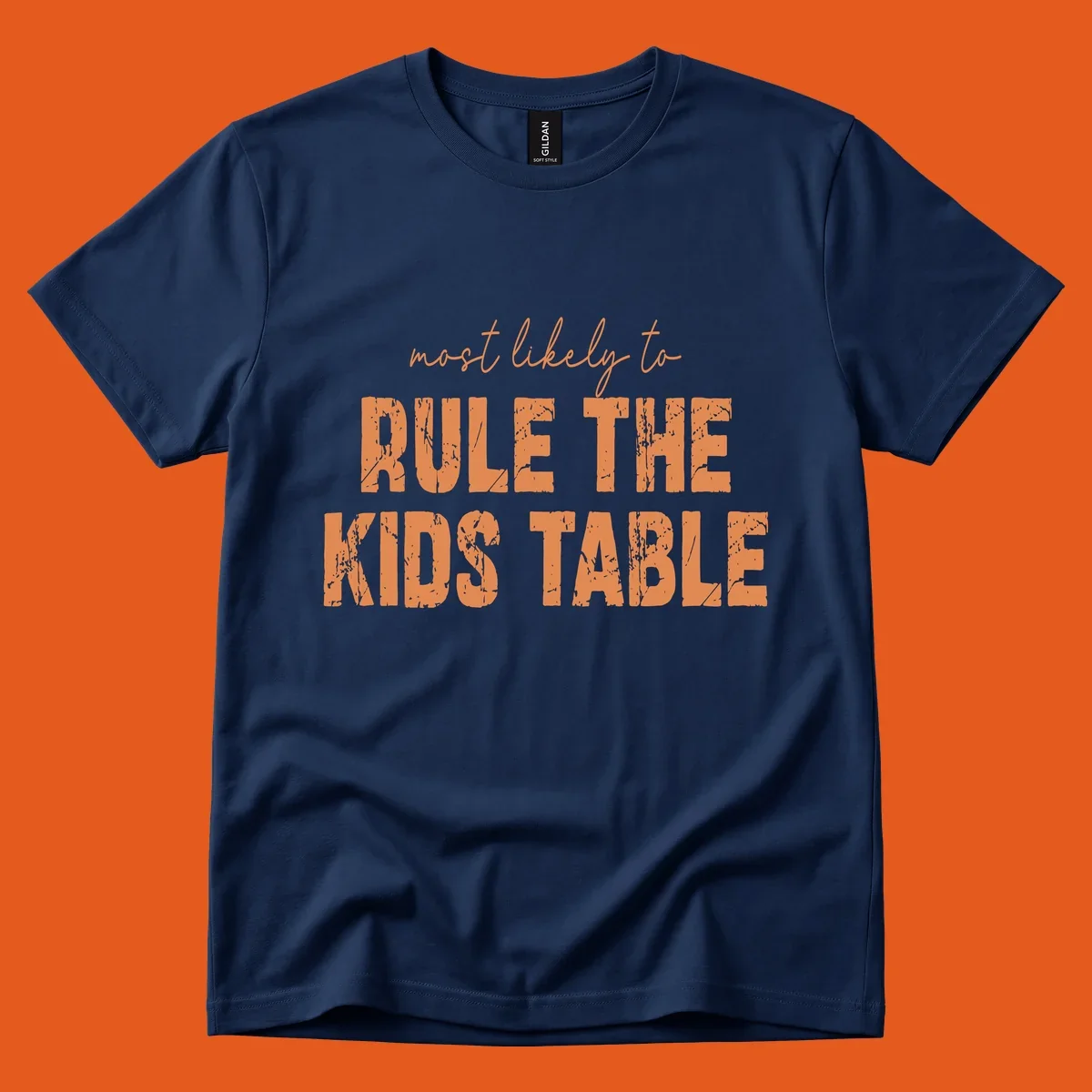 Text design 'Most Likely to Rule the Kids Table' in distressed orange font.
