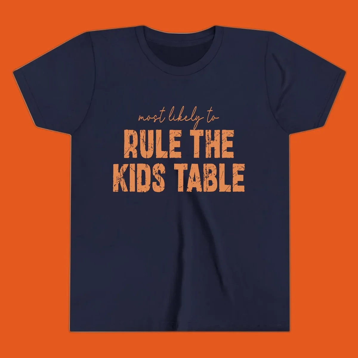 Text design 'Most Likely to Rule the Kids Table' in distressed orange font.