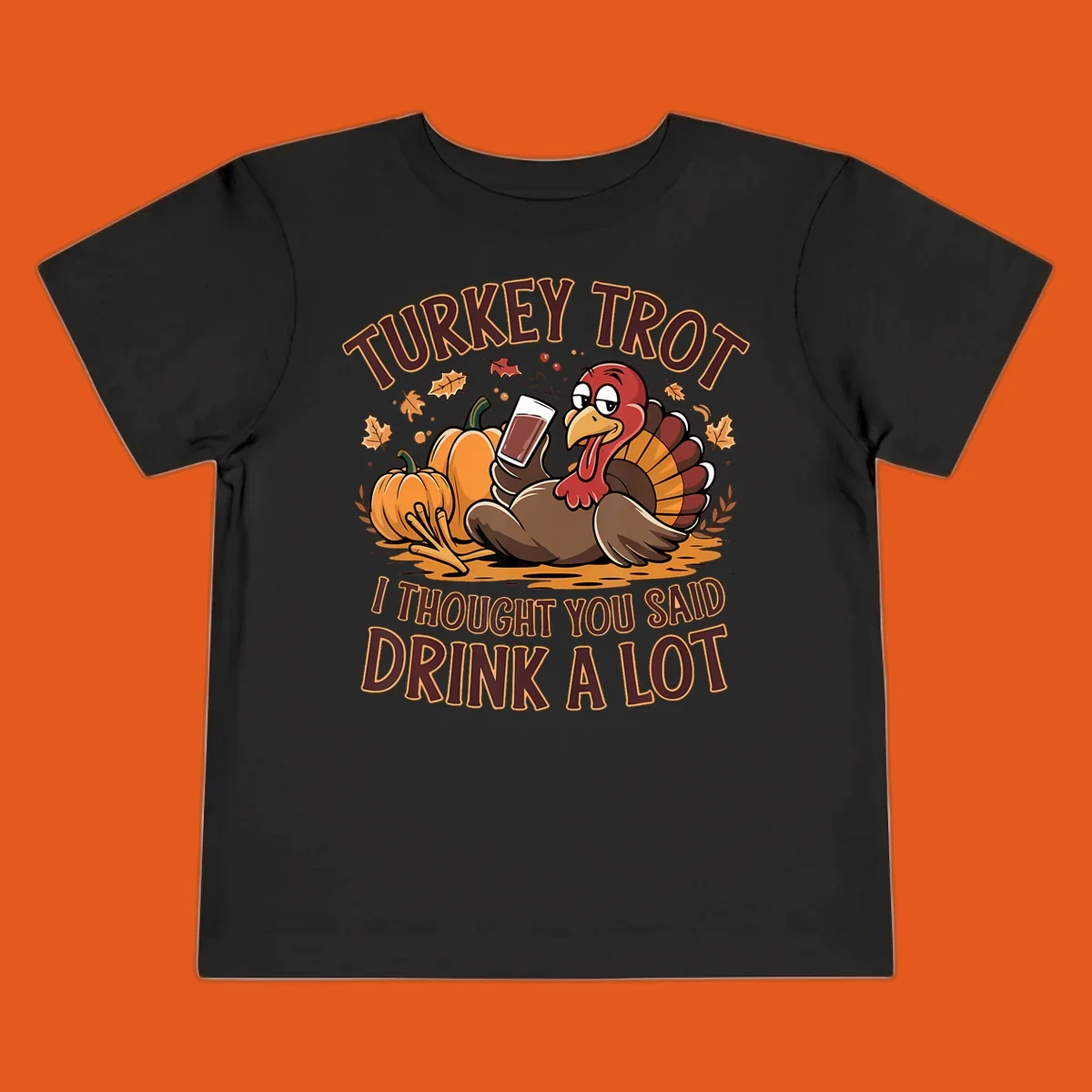 Cartoon turkey with pumpkins and text 'Turkey Trot I Thought You Said Drink A Lot' for Thanksgiving race.