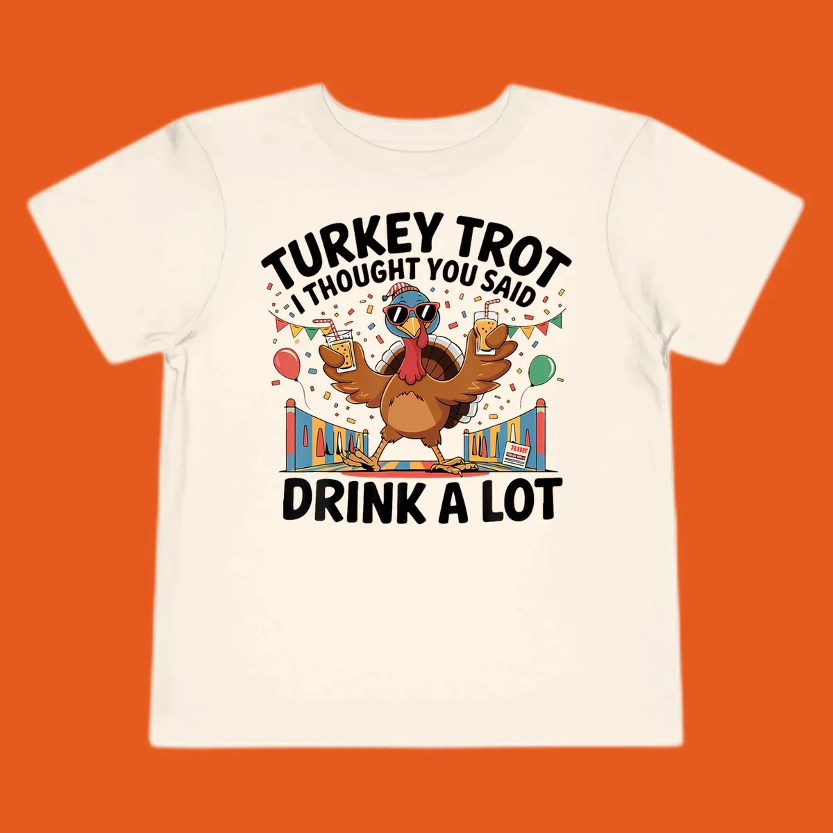 Turkey Trot I Thought You Said Drink A Lot design featuring a cartoon turkey with drinks, confetti, and text.