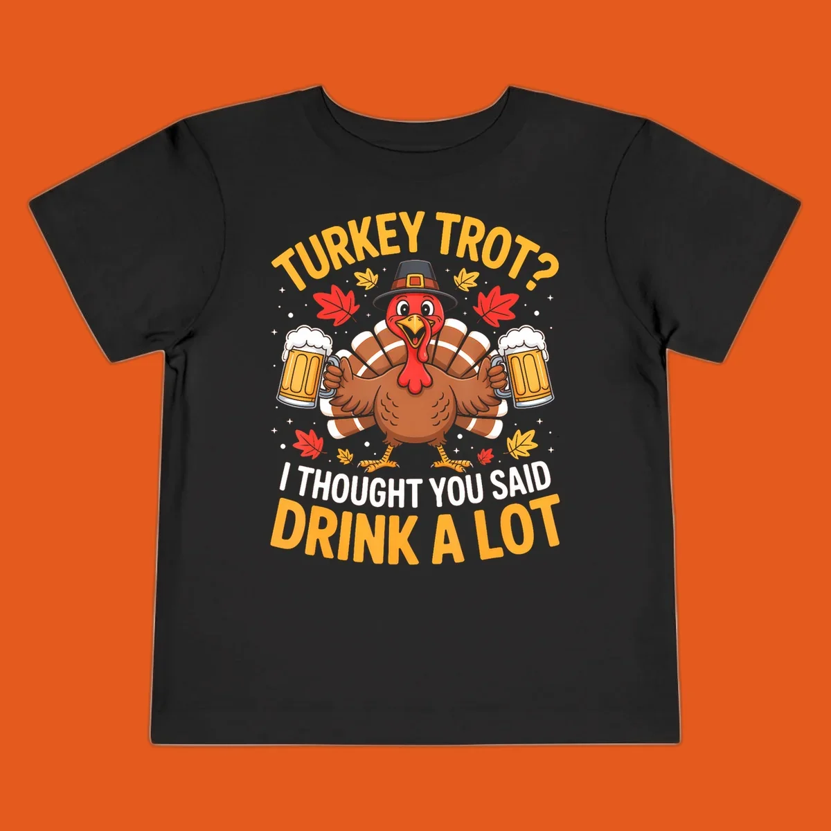 Turkey trot design with a turkey holding beer mugs, text says "Turkey Trot? I Thought You Said Drink A Lot."