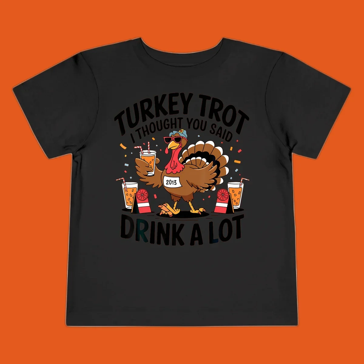 Turkey Trot I Thought You Said Drink A Lot design featuring a cartoon turkey holding a drink.