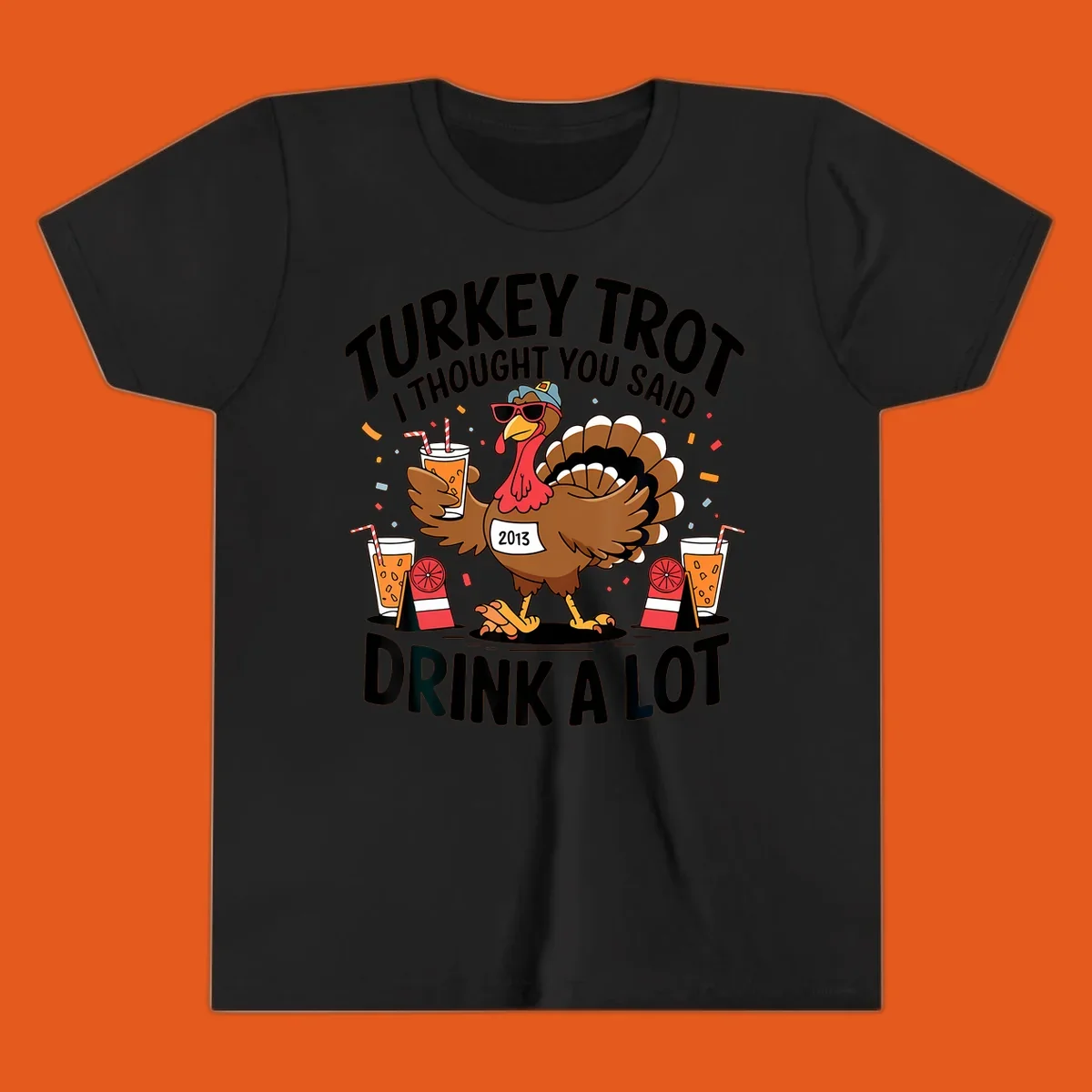 Turkey Trot I Thought You Said Drink A Lot design featuring a cartoon turkey holding a drink.