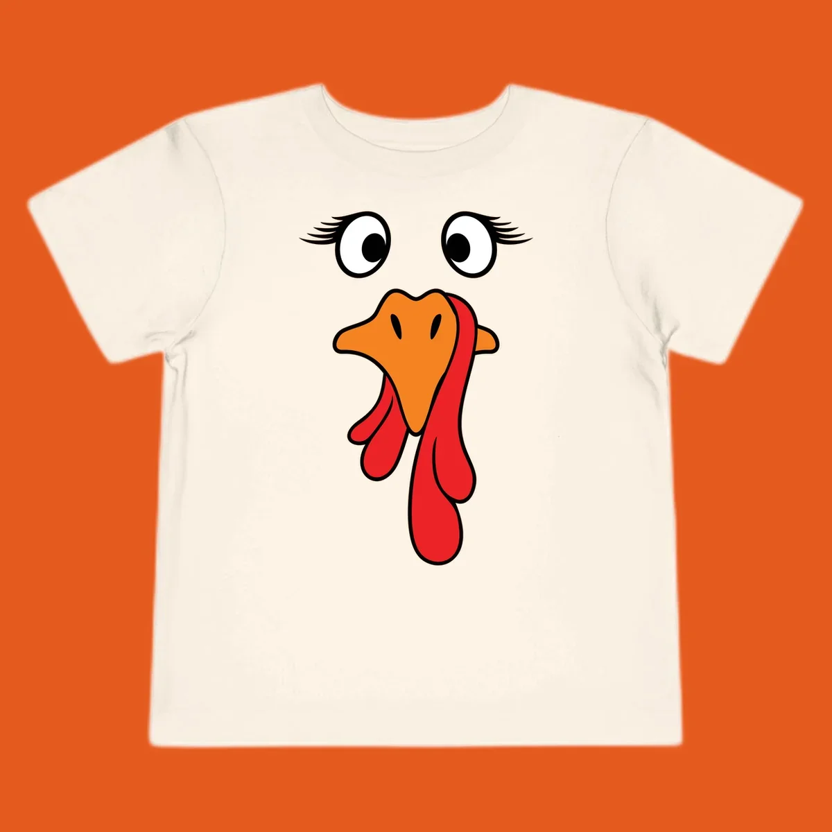 Funny turkey face graphic with googly eyes and wattle, perfect for Thanksgiving Trot runners.