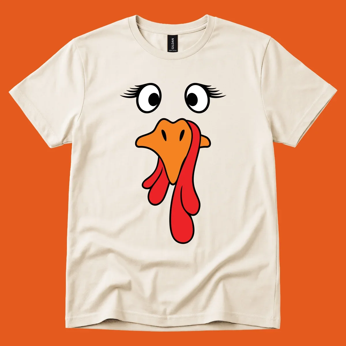 Funny turkey face graphic with googly eyes and wattle, perfect for Thanksgiving Trot runners.